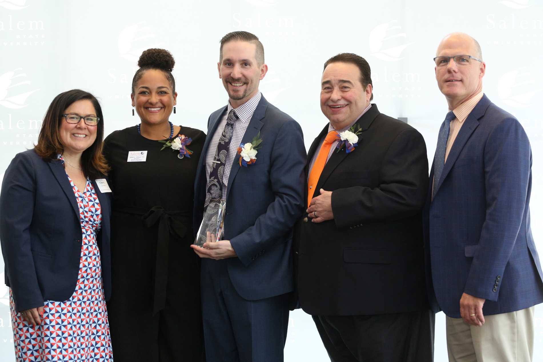 2019 Rising Star Award Winner Mike Mitchell '07 (Center)