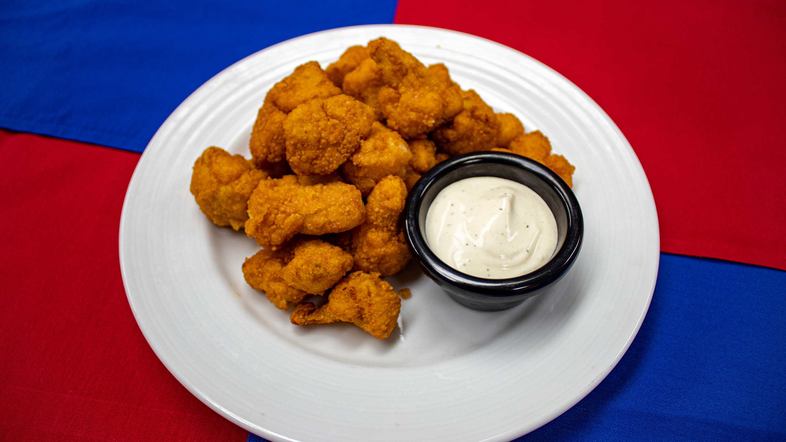 <strong>Fried Cauliflower</strong> - Tabasco marinated cauliflower lightly breaded and fried.  Served with a ranch dipping sauce. <em>Submitted by Michael Bell</em>