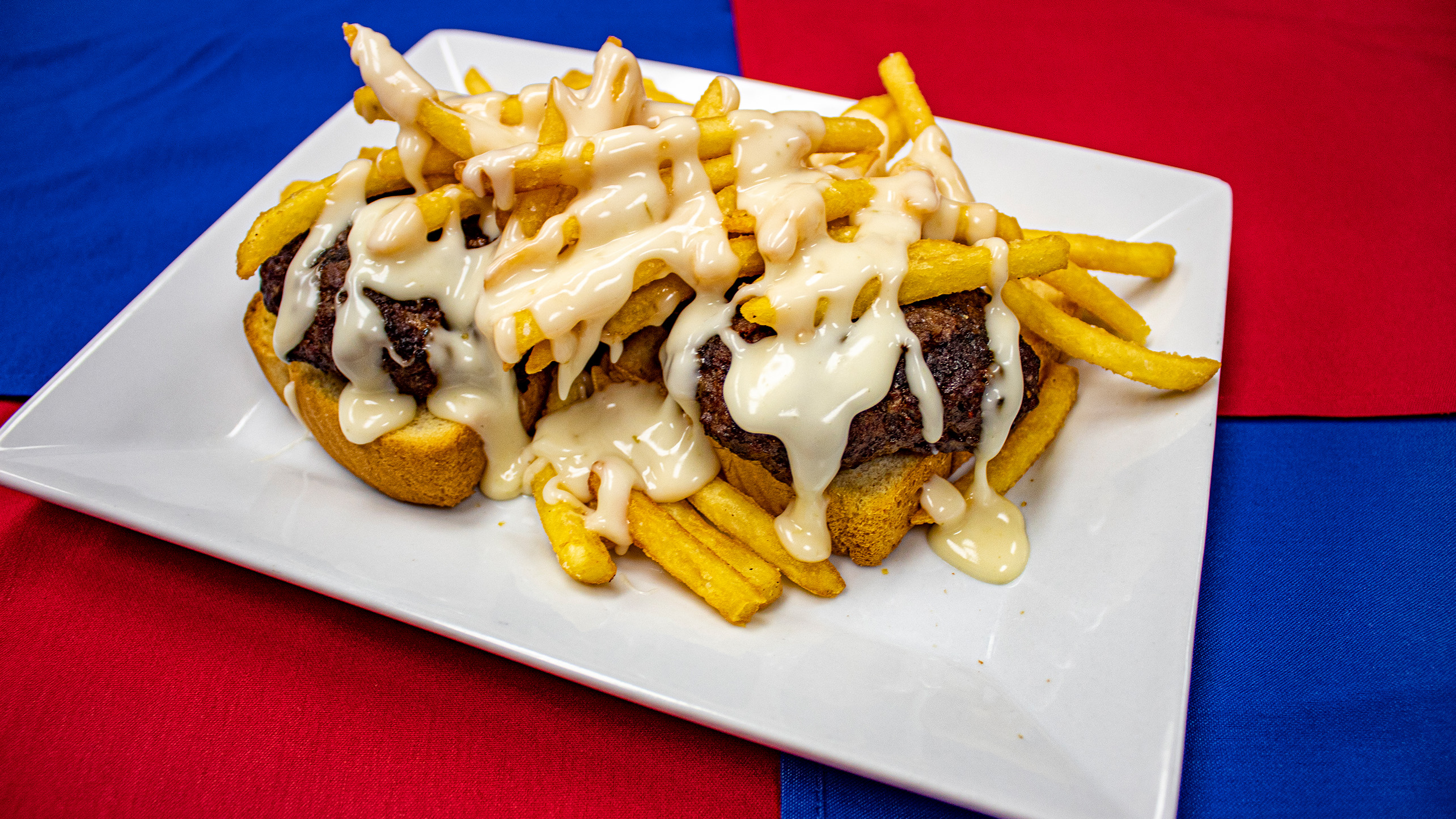 <strong>The Horseshoe</strong> – An open-faced sandwich with two slices of Texas toast with two hamburger patties, topped with French fries and cheese sauce. <em>Submitted by Kyle Shuppert</em>