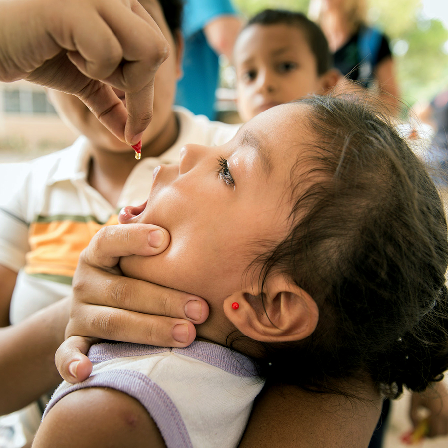  Squeeze vitamin A into mouth 