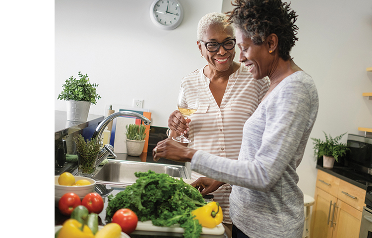 Two people smiling and enjoying each other's company intimately.