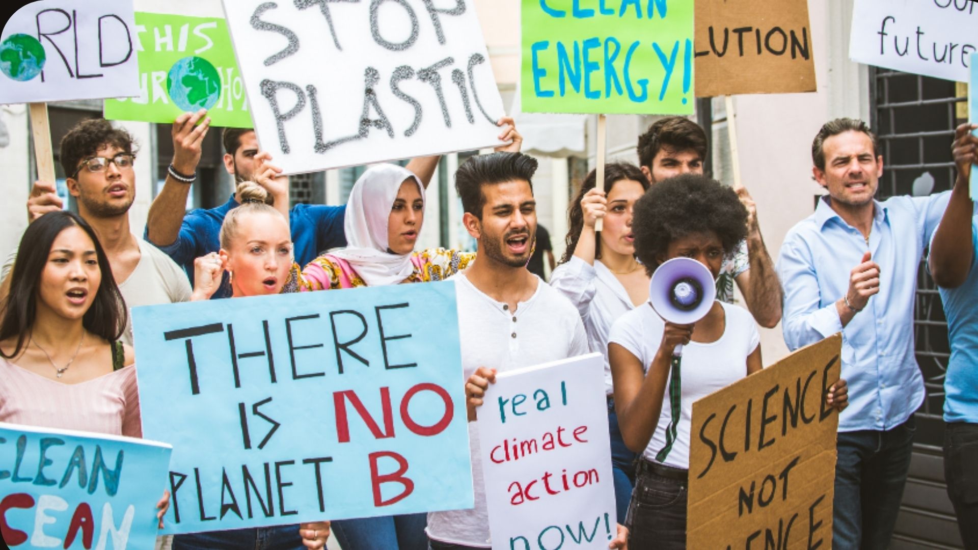young people at a protest with a sign "There is no planet B"