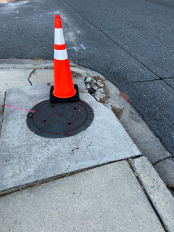 Sidewalk damage at the intersection of East and West 12/12/25