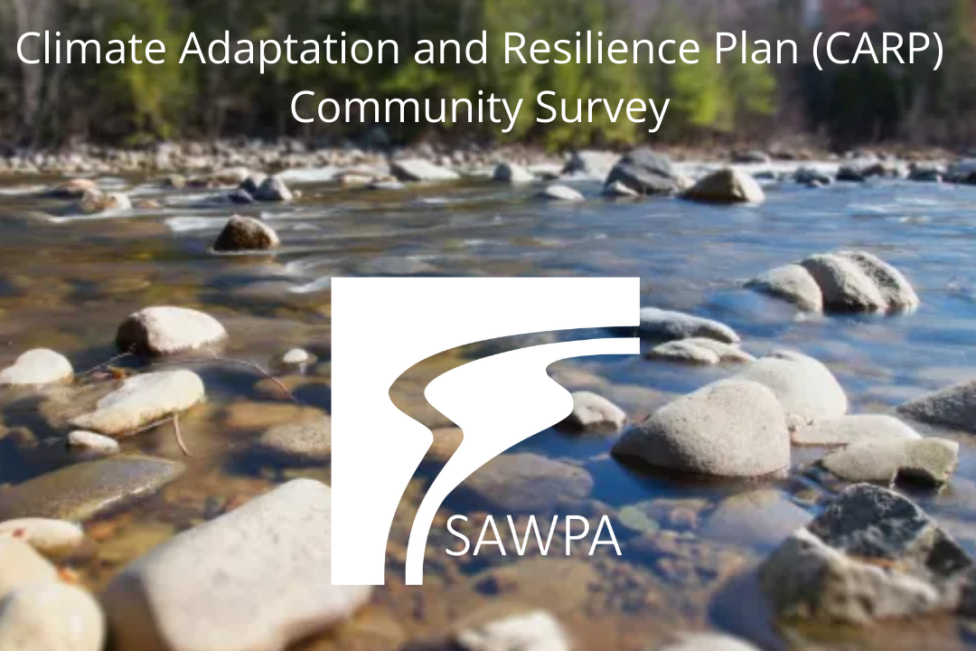 Sunset over city with warehouses and smog