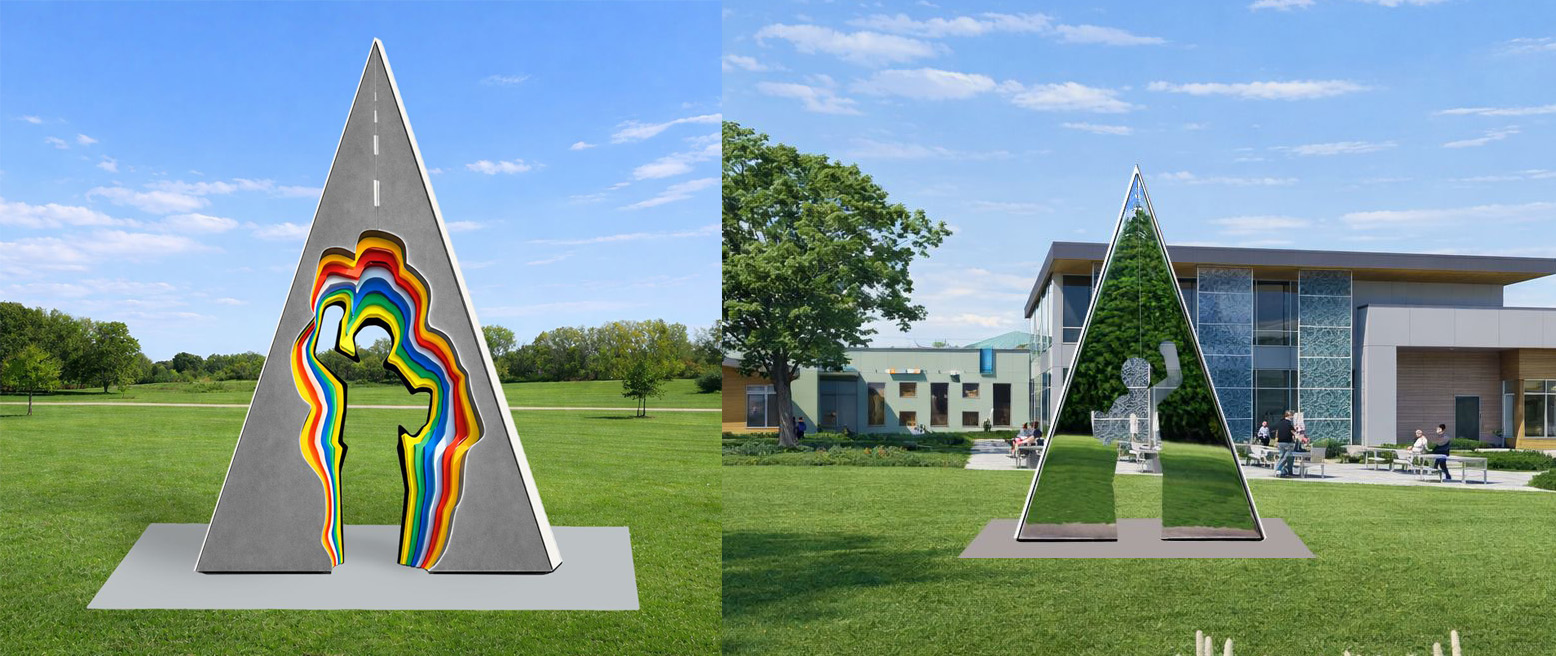 A triangular sculpture with a silhouette of a person in the center. On the front the person is surrounded by a paved road. On the back the mirrored surface reflects the surrounding park.