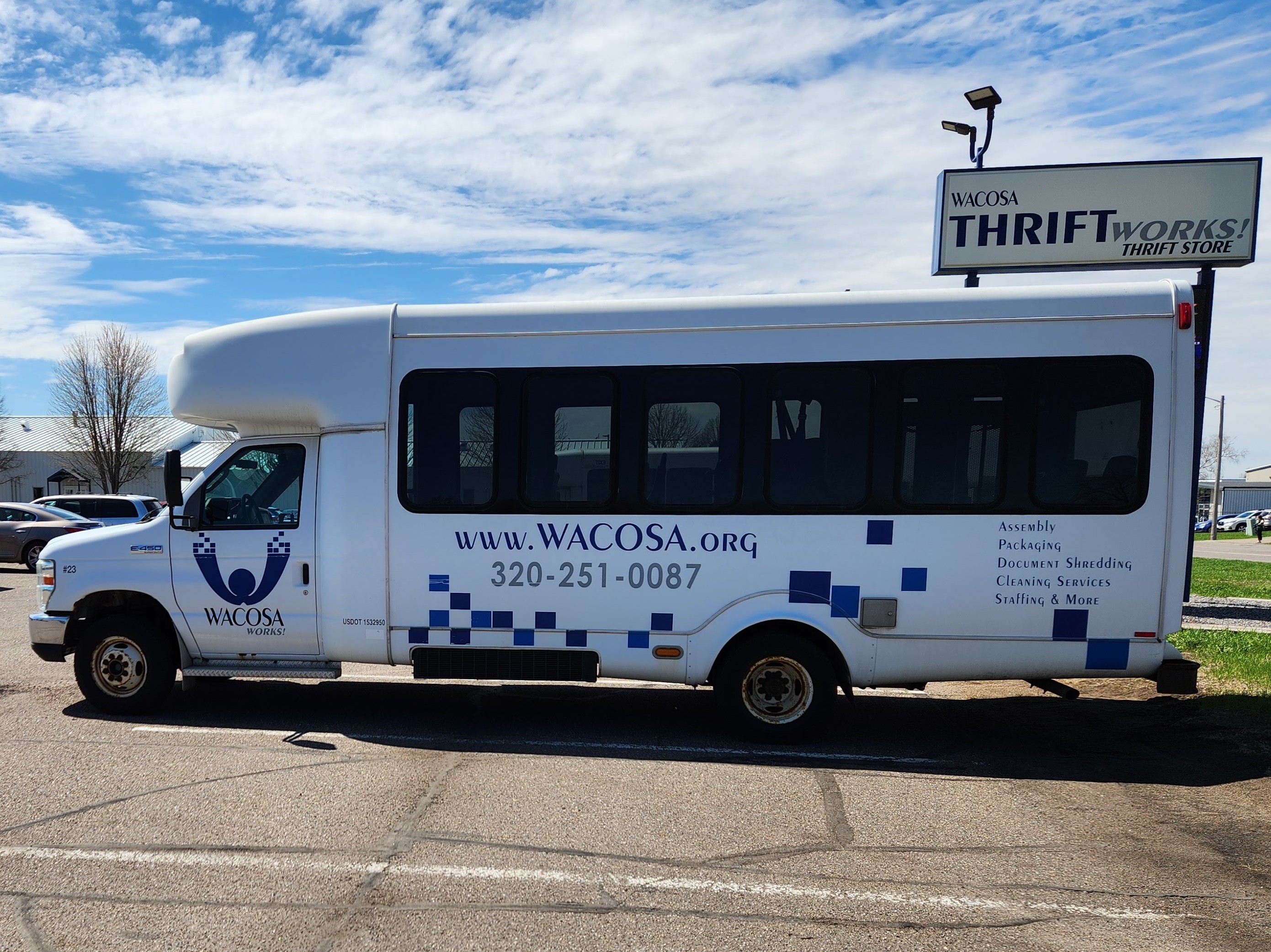 Photo of a WACOSA vehicle parked outside of the WACOSA ThriftWorks! facility in Waite Park.