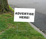 small sign on small metal poles stuck in the ground.