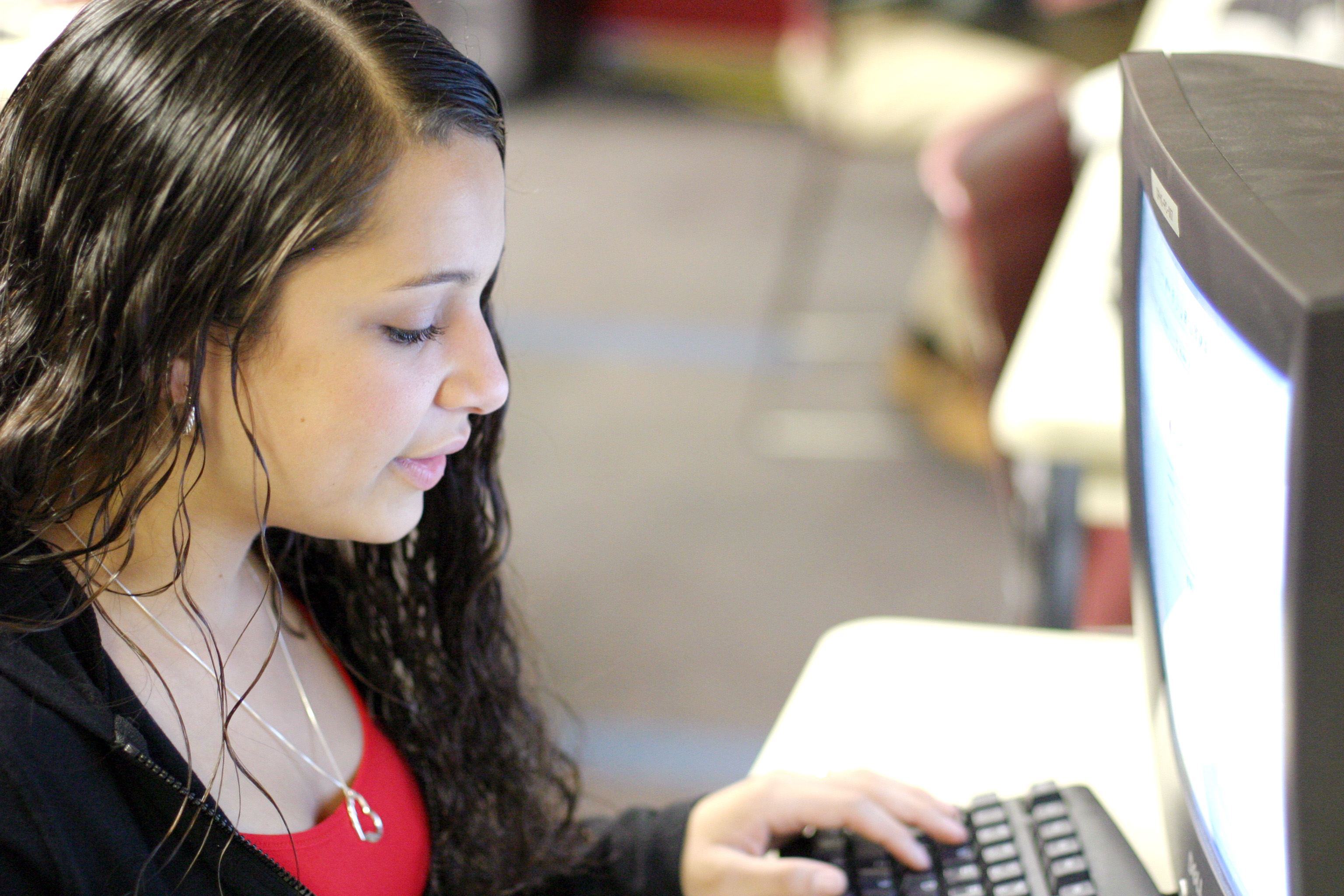 A student using a computer.