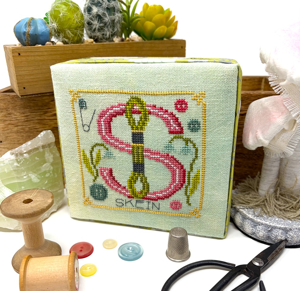 THE STITCH LIFE shown finished off as a cube - stitch all 6 letters and display them in your craft room on a table or a shelf OR however you wish. Would be super cute finished as cubes - stitch count 57w x 57h each letter - approx design size is 4" x 4" when stitched on the called for 28ct/14ct fabric