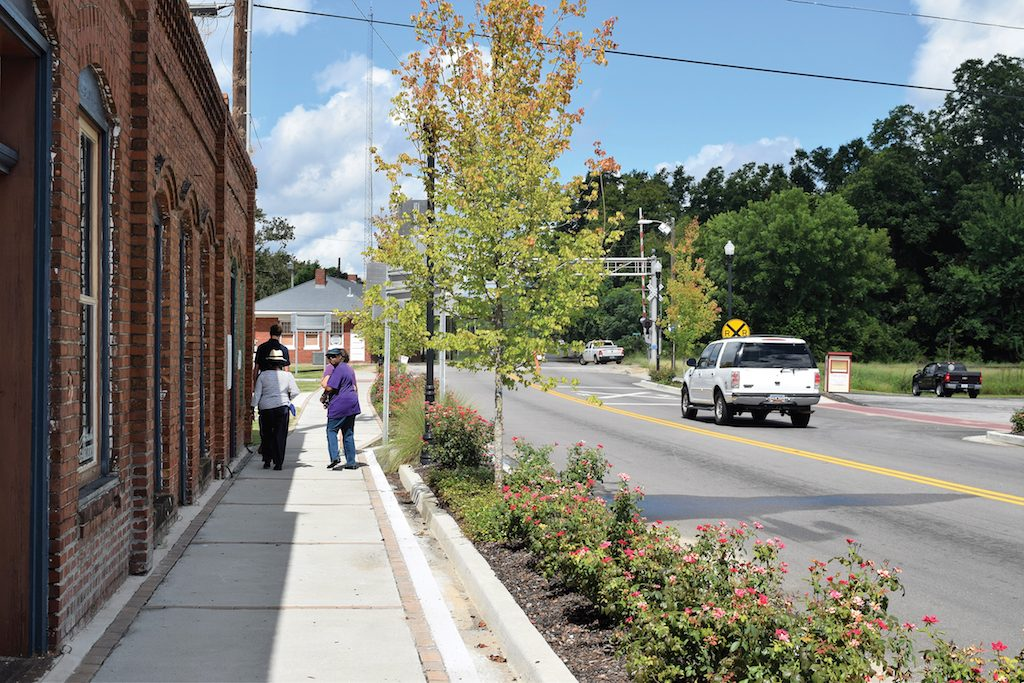  Protected sidewalks – sidewalks separated from the street with protective barriers 